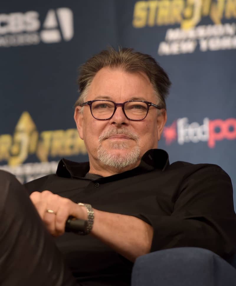 <p>Johnathan Frakes played the role of "William Thomas Riker" on the hit series Star Trek: The Next Generation. Before he went to space, he had already starred on a few popular shows like Hart to Hart, Highway to Heaven, The Fall Guy and many more. After the series ended, he moved on to star in several different television and movie productions such as well as all of the Star Trek feature films all the way up to 2002! He also hosted the show Beyond Belief: Fact or Fiction. Frakes is currently married to actress Genie Francis whom he met on the set of the TV mini-series North and South. The couple have two children.</p>