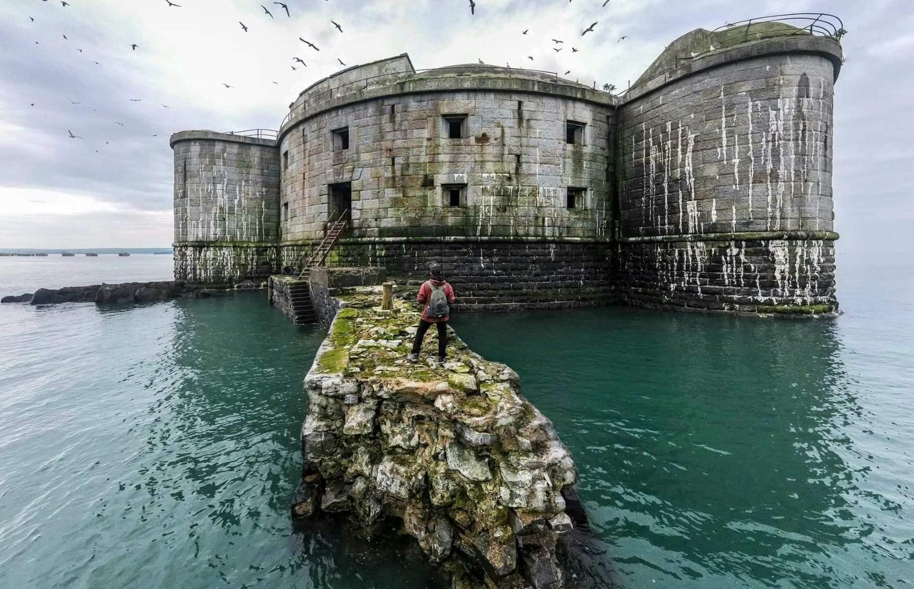 Sitting on a small island in Pembrokeshire's Milford Haven Waterway, Stack Rock Fort is a three-gun fort built between 1850 and 1852. Captured here by Steve Liddiard, who described it as "a true time capsule of British military history", the landmark looks all the more striking against gray skies with birds circling overhead.