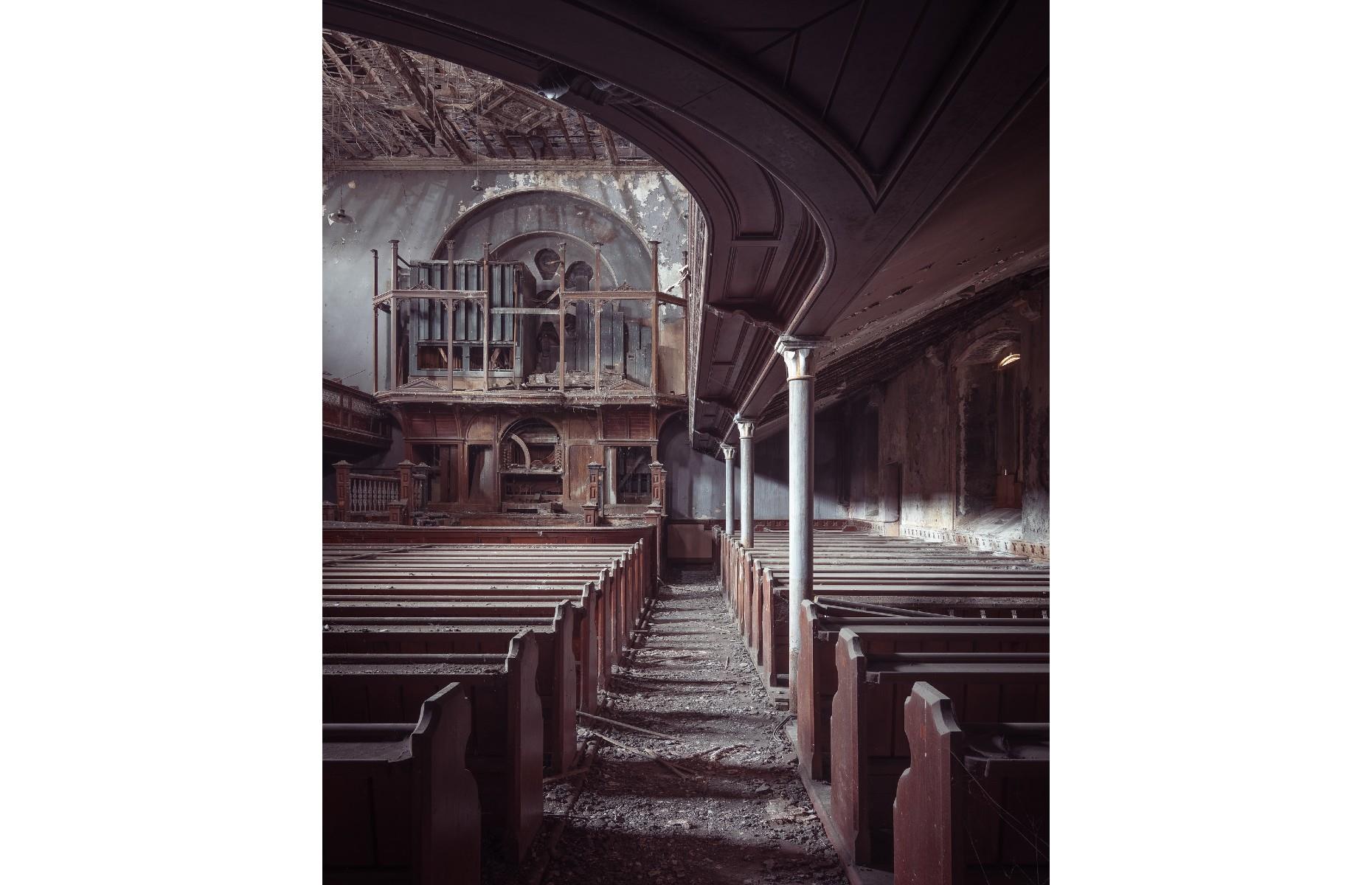 <p>Now derelict, the Grade II-listed Calfaria Baptist Chapel in Llanelli was built in 1881 and was once a thriving community hub, but has lain empty for the last two decades. Paul Harris reveals its eerie beauty in this atmospheric shot, revealing the dusty floors, crumbling wooden pillars and dilapidated ceiling – we wouldn't want to get caught here alone...</p>  <p><a href="https://www.loveexploring.com/galleries/86634/haunting-photos-of-the-worlds-abandoned-sacred-places?page=1"><strong>Haunting photos of the world's abandoned sacred places</strong></a></p>