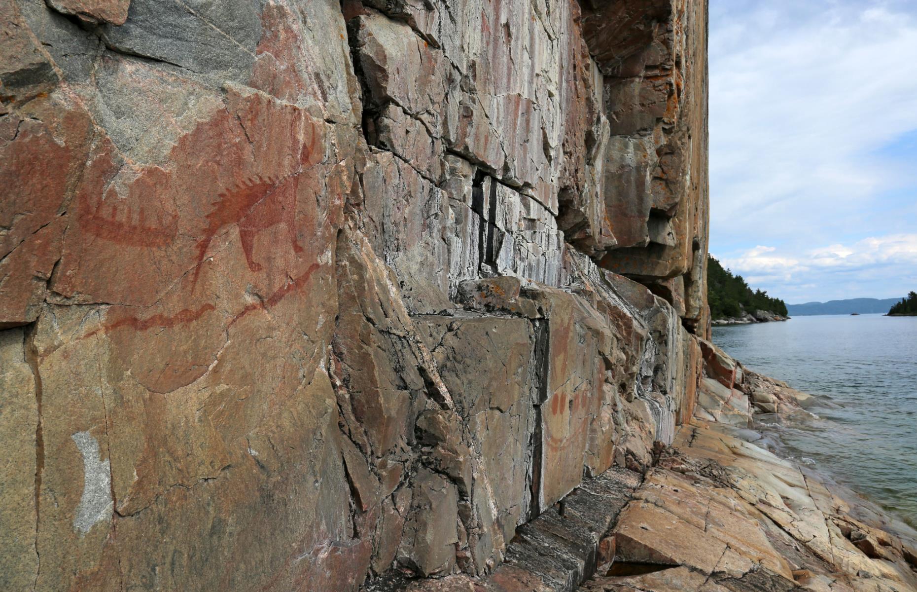 <p>Indigenous peoples lived throughout Canada long before settlers landed, so the country is filled with sacred sites of varying cultural importance. The <a href="https://www.ontarioparks.com/park/lakesuperior">Agawa Rock</a> pictographs can be found in Lake Superior Provincial Park – these are red-ochre rock paintings created by Ojibwe artists several centuries ago. The paintings are a little bit out of the way – tourists can access the park near Sault Ste Marie and then take a short hike to the site.</p>