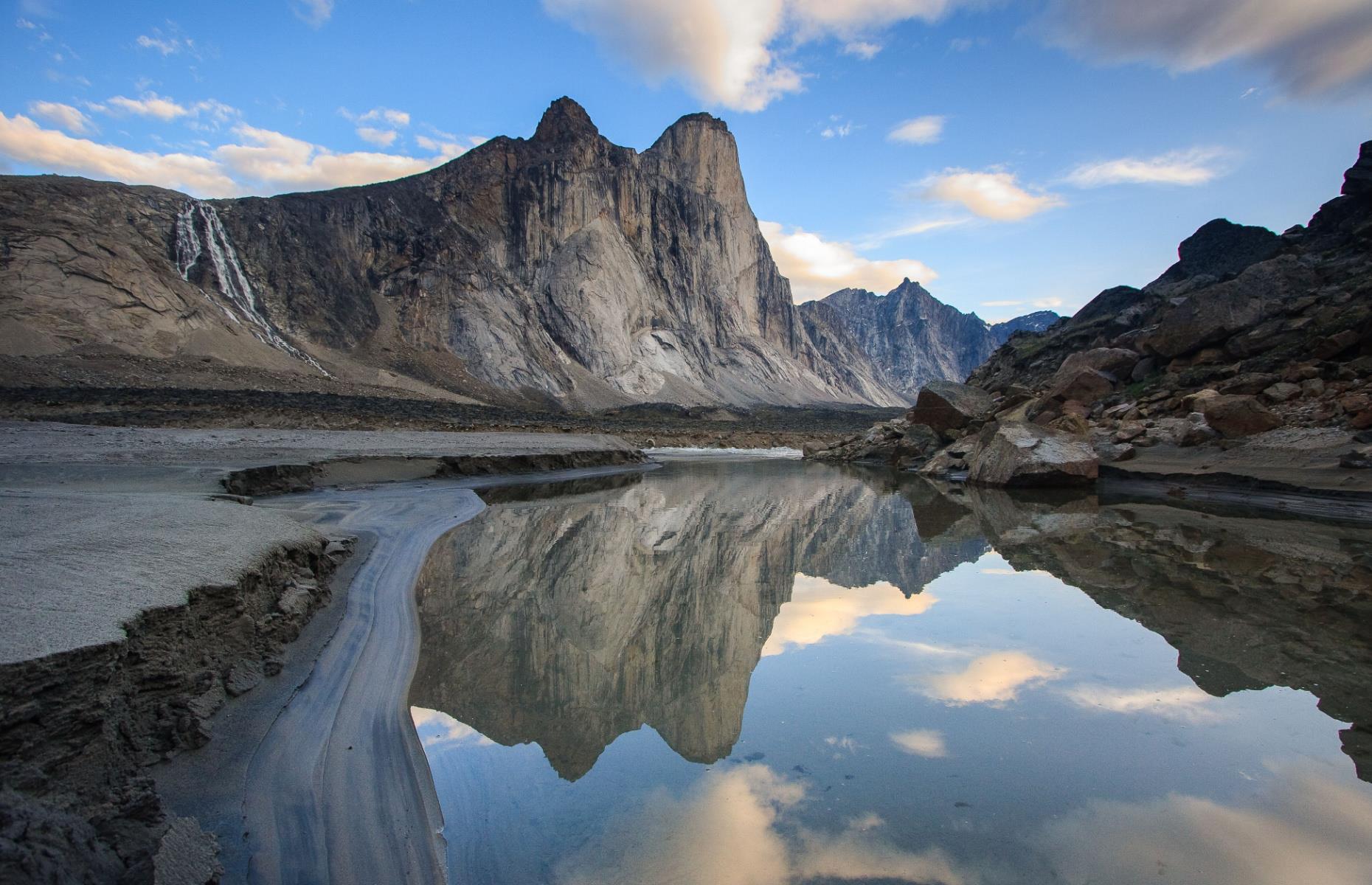 <p>One of the largest islands in the world, Baffin Island is easy to spot on a globe, but its far-north location can make it challenging to reach. The island’s <a href="https://www.pc.gc.ca/en/pn-np/nu/auyuittuq">Auyuittuq National Park</a> offers a prime view of Canada’s incredible north, with untouched swaths of ancient rock formations and stunning fjords. Visiting features like the Akshayuk Pass is a dream for any adventurer or mountaineer lucky enough to make it to this wild wonderland.</p>