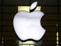 FILE: The Apple logo is illuminated at a store