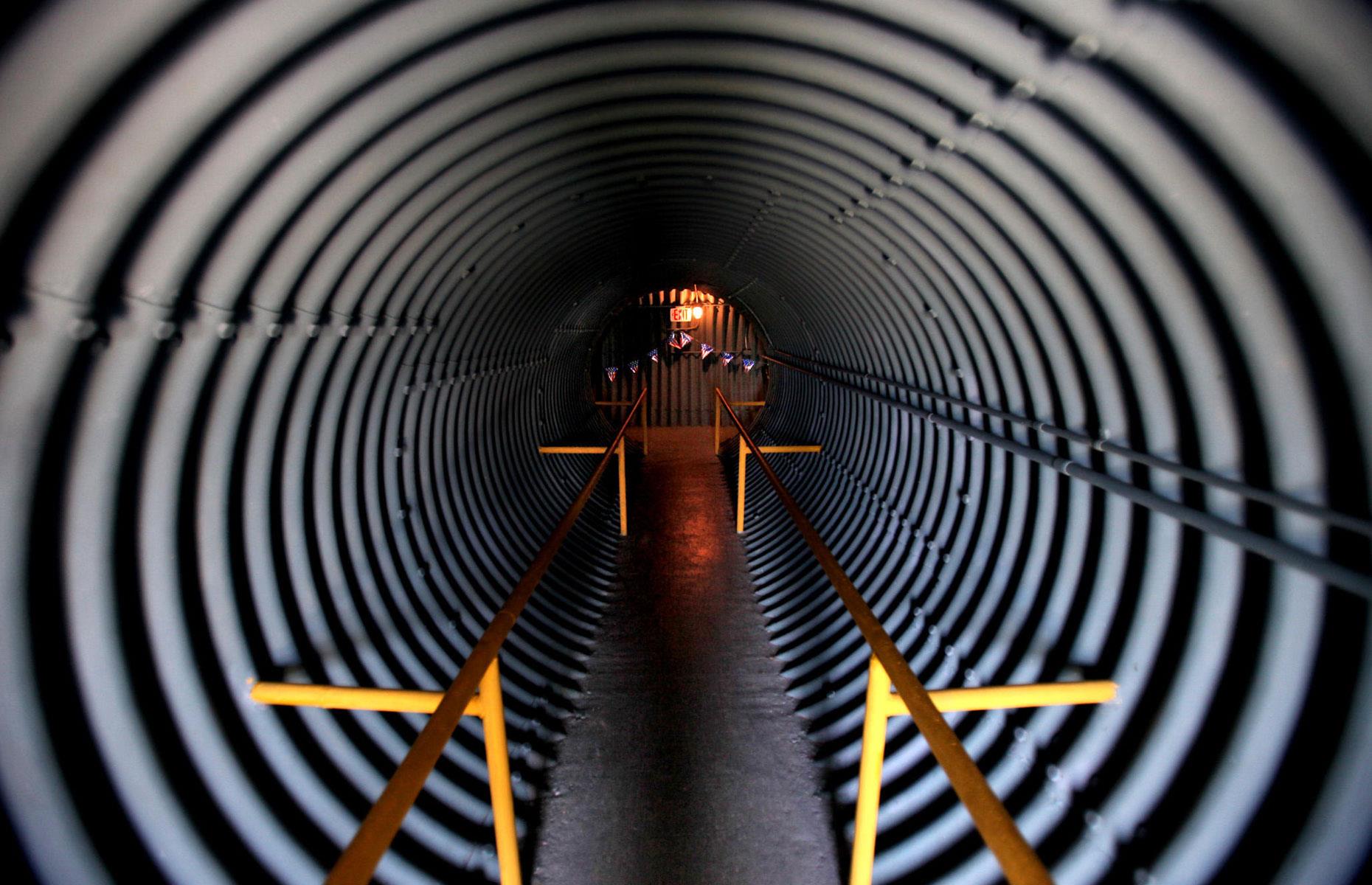 <p>Covered with 12 feet of earth and layers of concrete and lead, the bunker itself is located through a 40-foot-long corrugated metal tunnel, featuring a sharp 90-degree bend to mitigate the effects of a nuclear blast. While the installation wouldn't have survived a direct hit, it would have protected its occupants from a more distant blast, not to mention the ensuing fallout, for up to 30 days.</p>