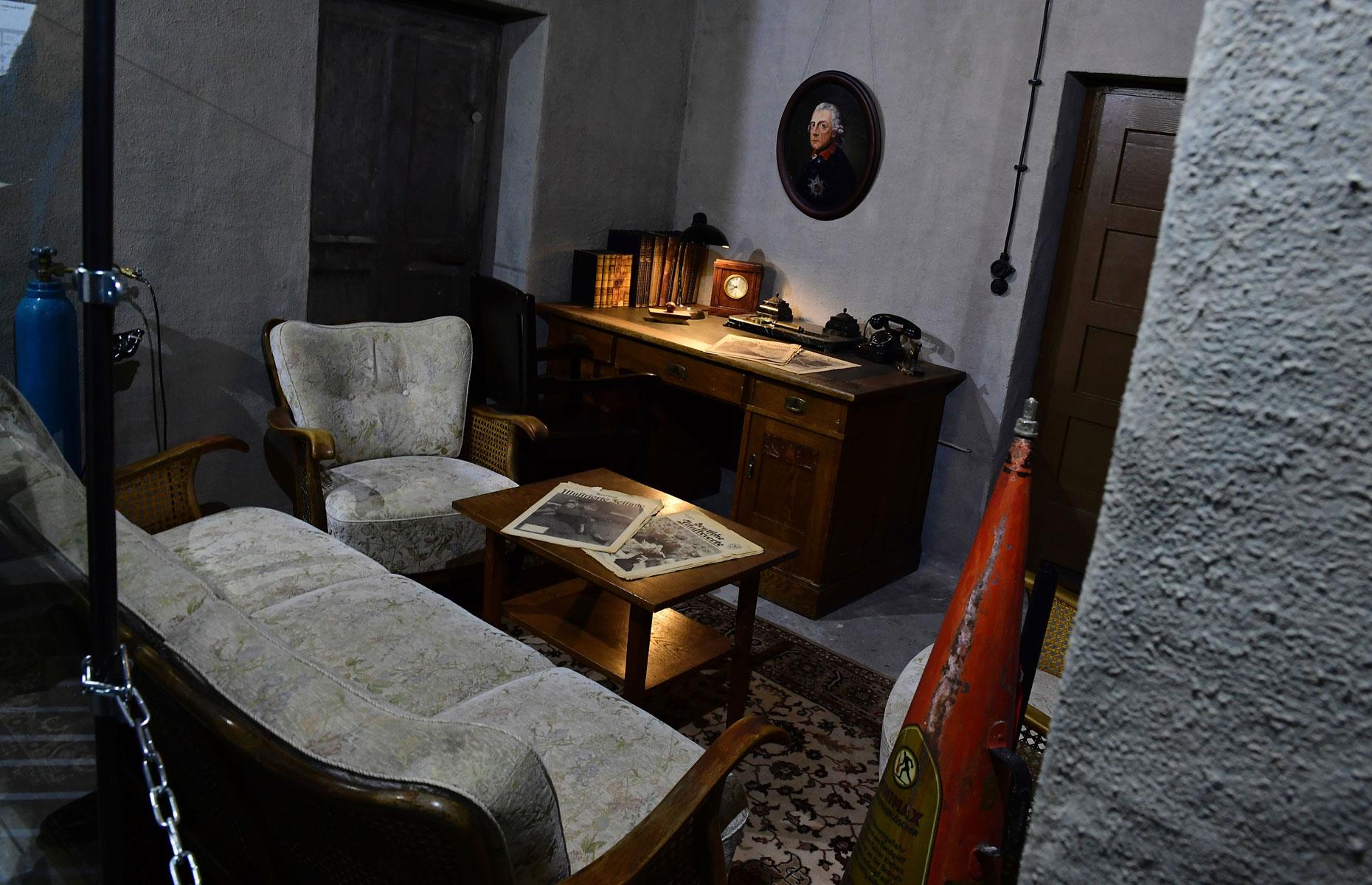 <p>This model of Hitler's study—the scene of their joint suicide—is on display in the Berlin Story museum. It was in this room that Eva Braun and Hitler both took cyanide capsules, and the Nazi leader also shot himself, on 30 April 1945. The couple were married in the bunker's map room the day before in a somber ceremony followed by an even gloomier reception, both aware of Soviet troops drawing ever closer.</p>