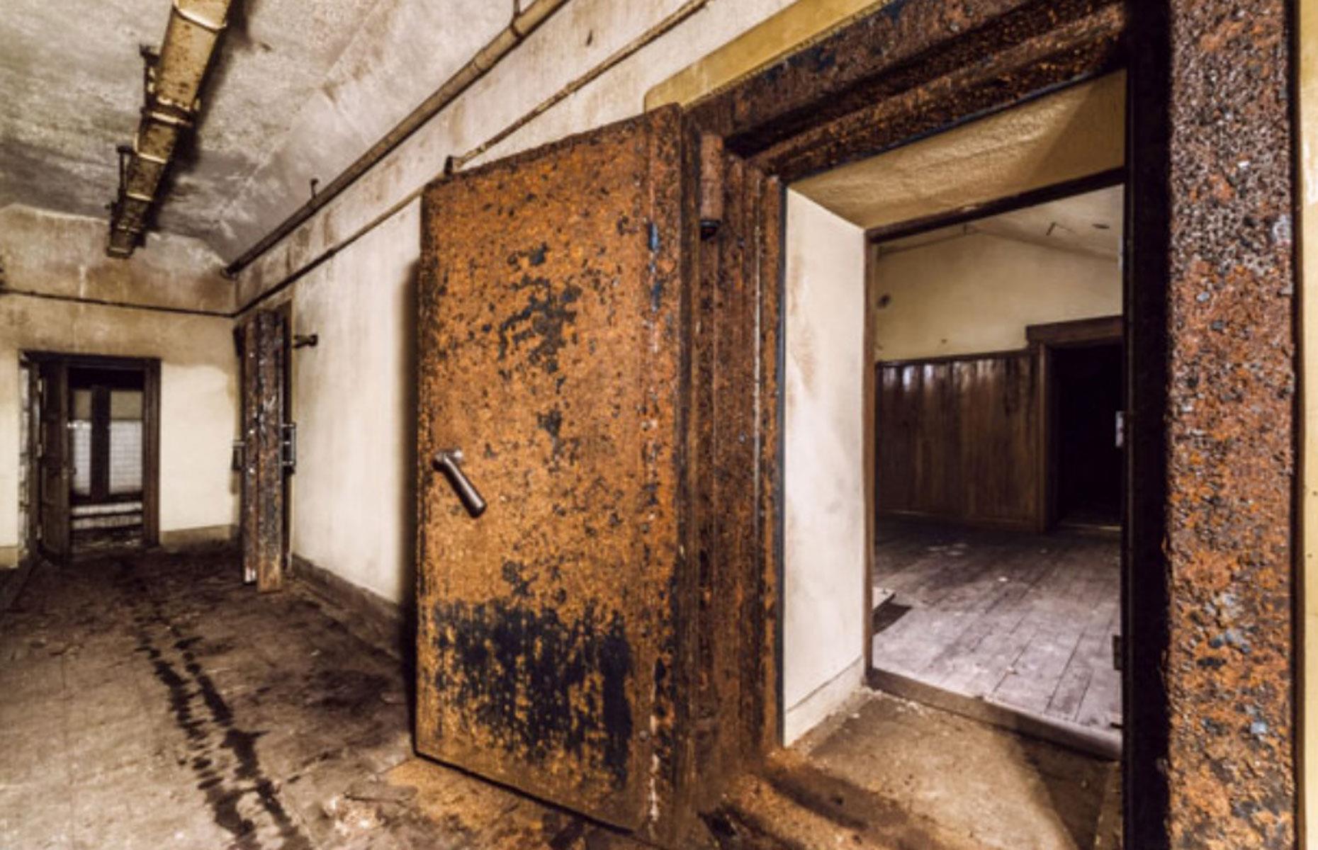 <p>As you can see from this shot of the desolate passageway, the bunker's anti-gas blast doors are covered in rust and rising damp stains the walls. Still, there's very little in the way of severe structural damage, judging by the picture. This <a href="https://www.loveproperty.com/gallerylist/91803/awesome-abandoned-bunkers-for-sale">abandoned bunker</a> was certainly built to last.</p>