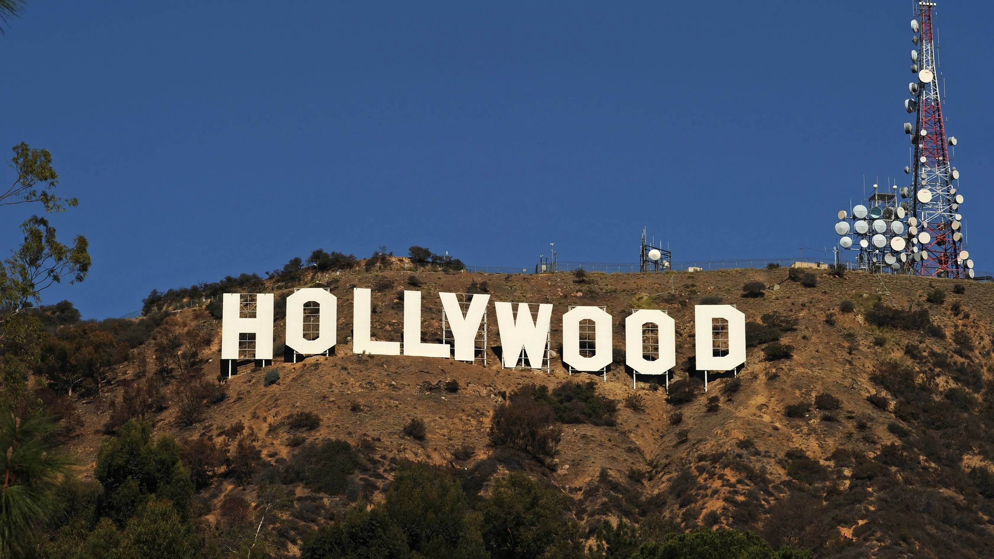 Холливуд программа. Лос Анджелес надпись Голливуд. Лос-Анджелес Калифорния Голливуд. Лос-Анджелес Калифорния надпись на горе Hollywood. Знак Голливуда Калифорния.