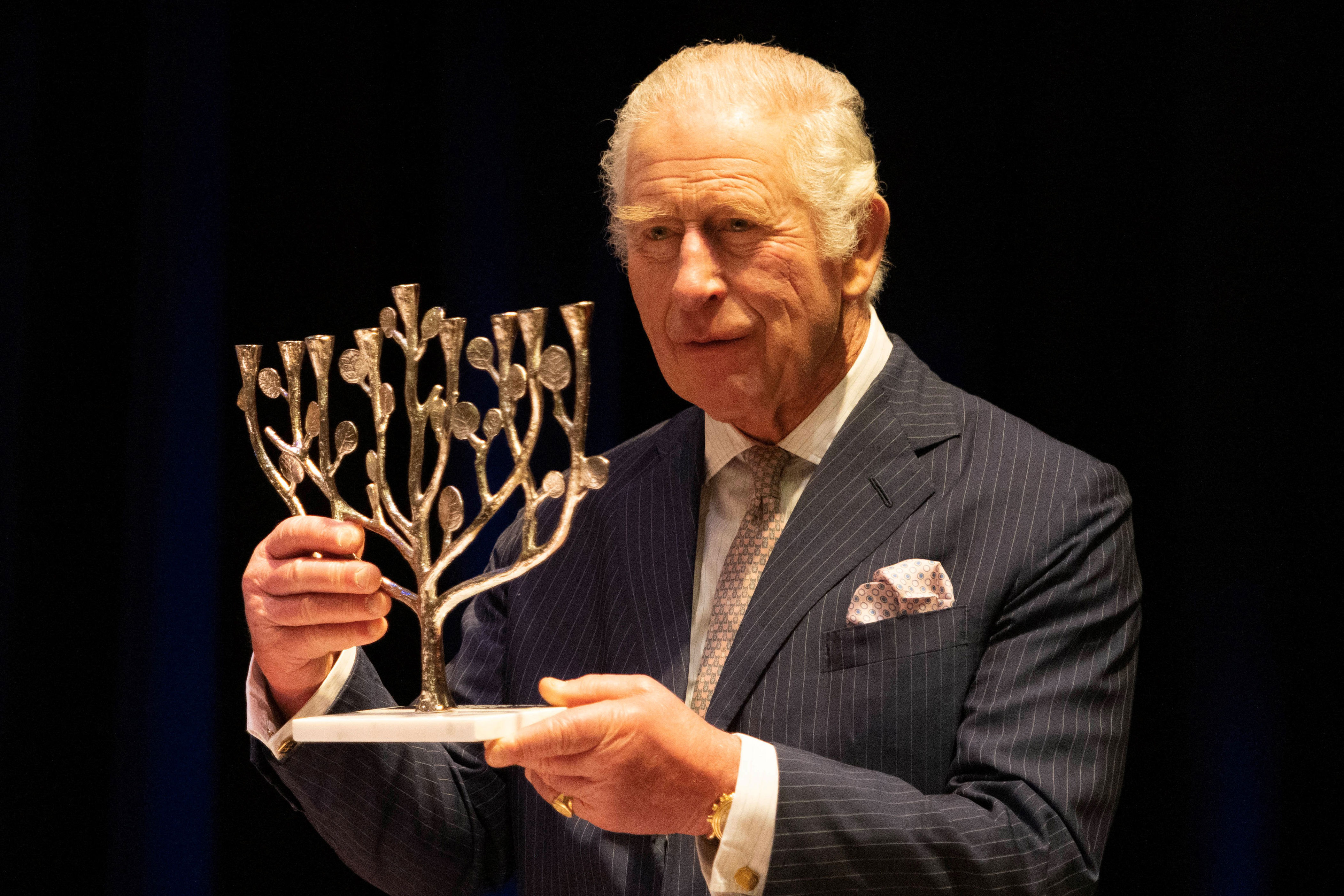 <p>King Charles III received a menorah during his visit to JW3, a Jewish community center that's open to all faiths and acts as a hub for the arts, culture, social action and learning in London on Dec. 16, 2022 -- two days before Hanukkah began.</p>