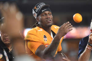 Tennessee quarterback Joe Milton III (7) throws oranges to his teammates after the Orange Bowl game between the Tennessee Vols and Clemson Tigers at Hard Rock Stadium in Miami Gardens, Fla. on Friday, Dec. 30, 2022. Tennessee defeated Clemson 31-14.