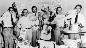 Hank Williams (center, with hat and guitar) and the Drifting Cowboys pose for a photo at the studios of WSM Radio, circa 1950, in Nashville, Tennessee. Michael Ochs Archives/Getty Images