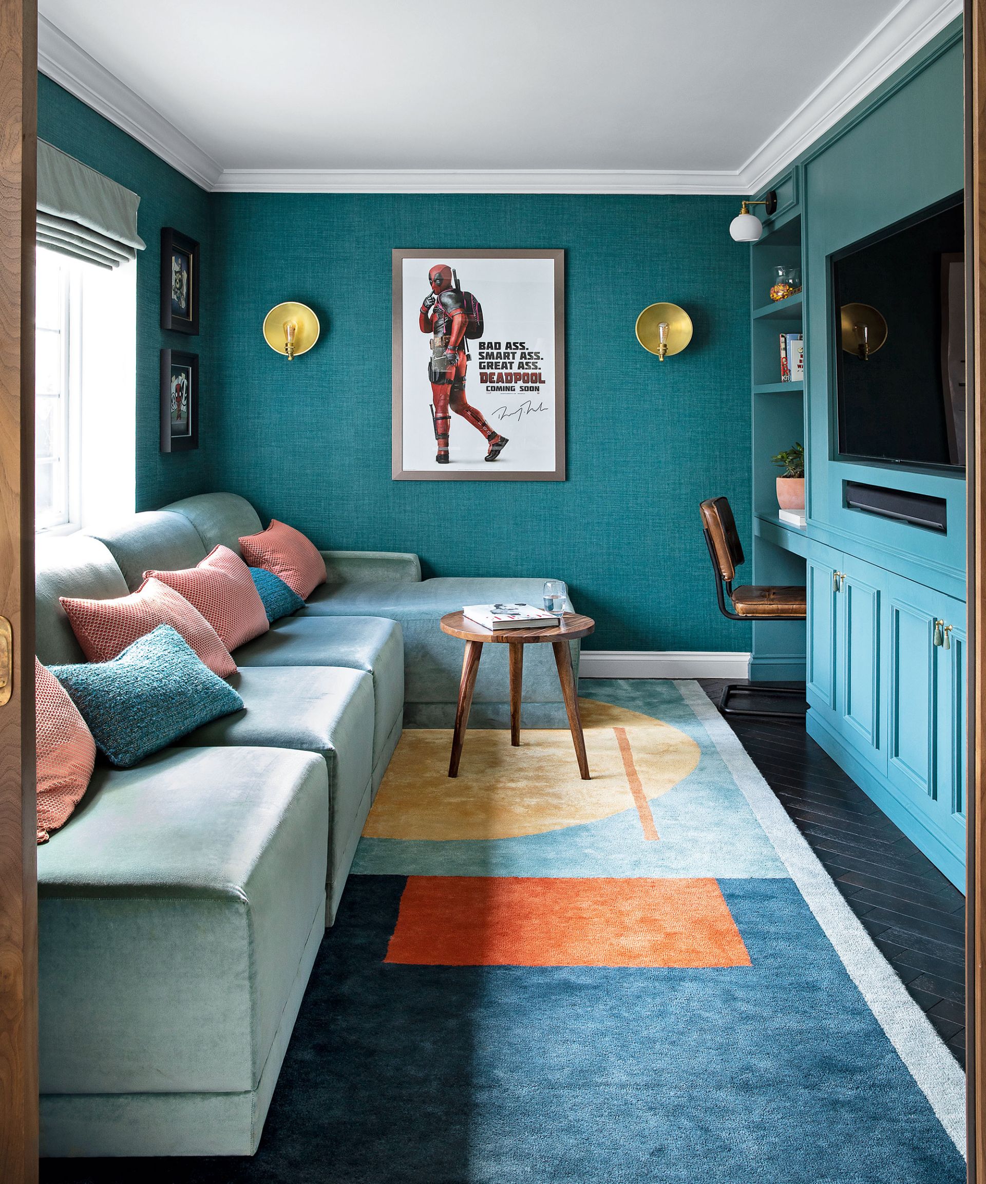 <p>                     Historical archives inspired Melissa Bolivar of design firm House of Sui Sui when creating this cosseting space.                    </p>                                      <p>                     'The room was designed to be an immersive experience with the walls, cabinetry, sofa and rug all in tones of teal and aquamarine; the result is incredibly impactful,' says Melissa. 'Here, a clever combination of hidden and open storage works beautifully around a TV, which has been built-into the space.'                   </p>