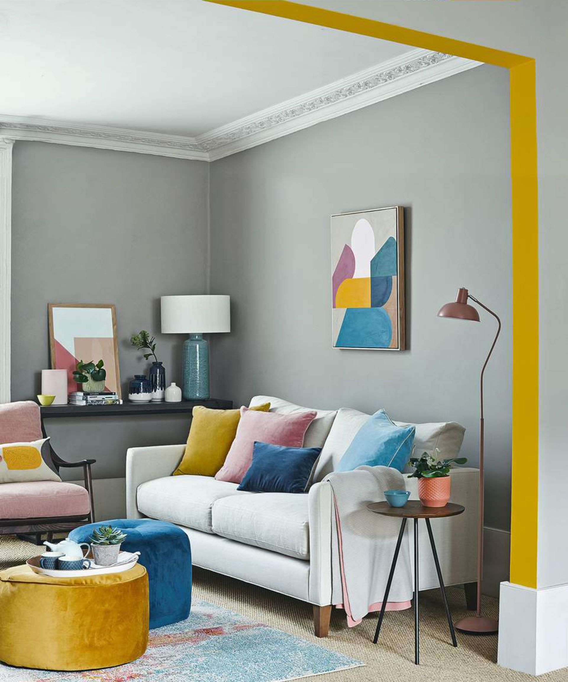 <p>                     If you're a color lover, it's a great idea to see a pale grey as a simple blank canvas from which you can mix and match colors of your choice. Like with many interior design rules, think odd numbers. In the above image, three colors are used together throughout the space in various shades - pink, blue and yellow – and it works to bring life to the neutral gray scheme.                    </p>                                      <p>                     Yellow and gray living rooms are a popular choice as this color combo never disappoints.                       </p>