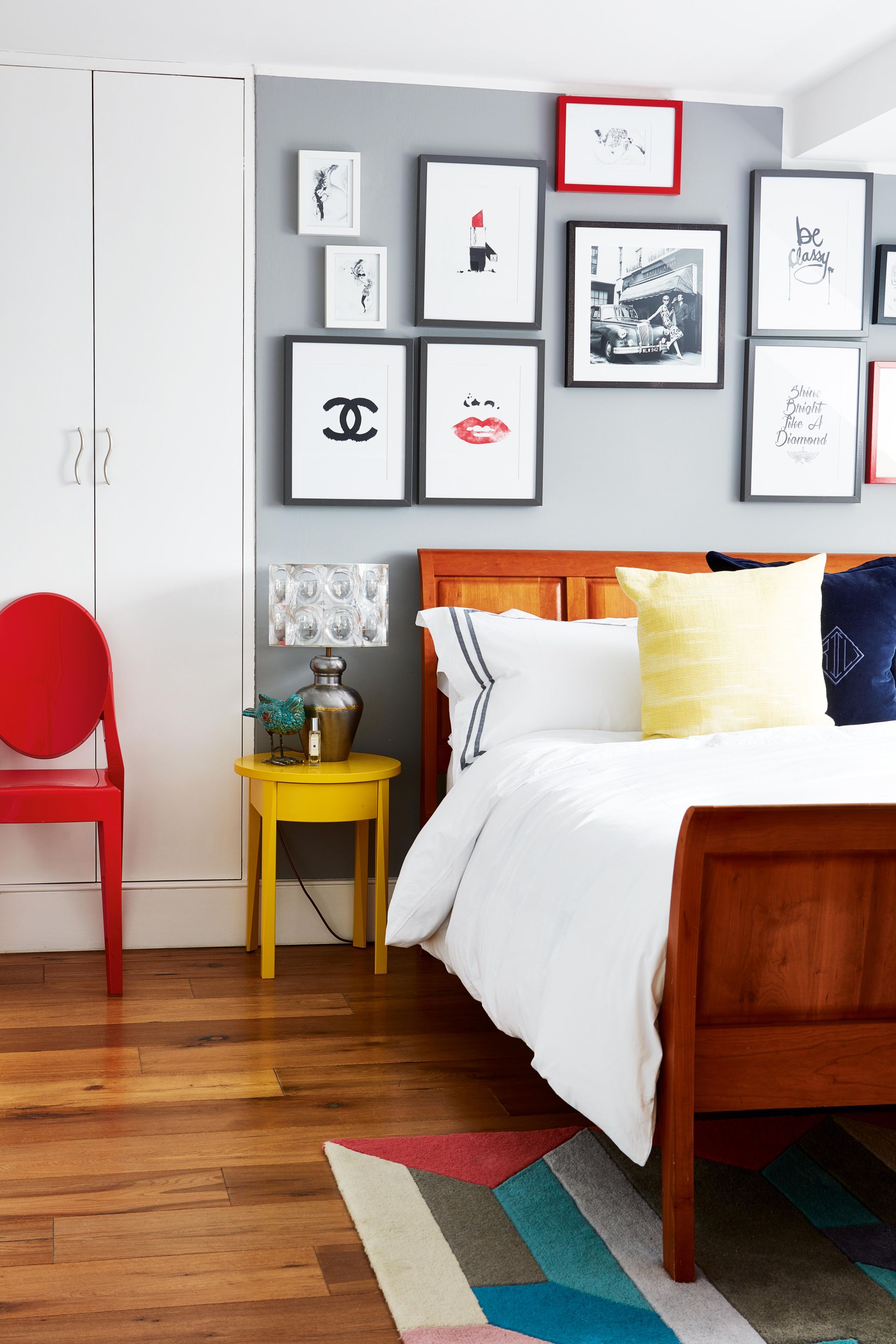 <p>                     Give your calm grey room a pop of something powerful by injecting splashes of red, yellow and blue. This gallery wall subtly blends vibrant red in with its monochrome palette, and the pale grey wall becomes a simple stage which lets the pictures shine.                    </p>