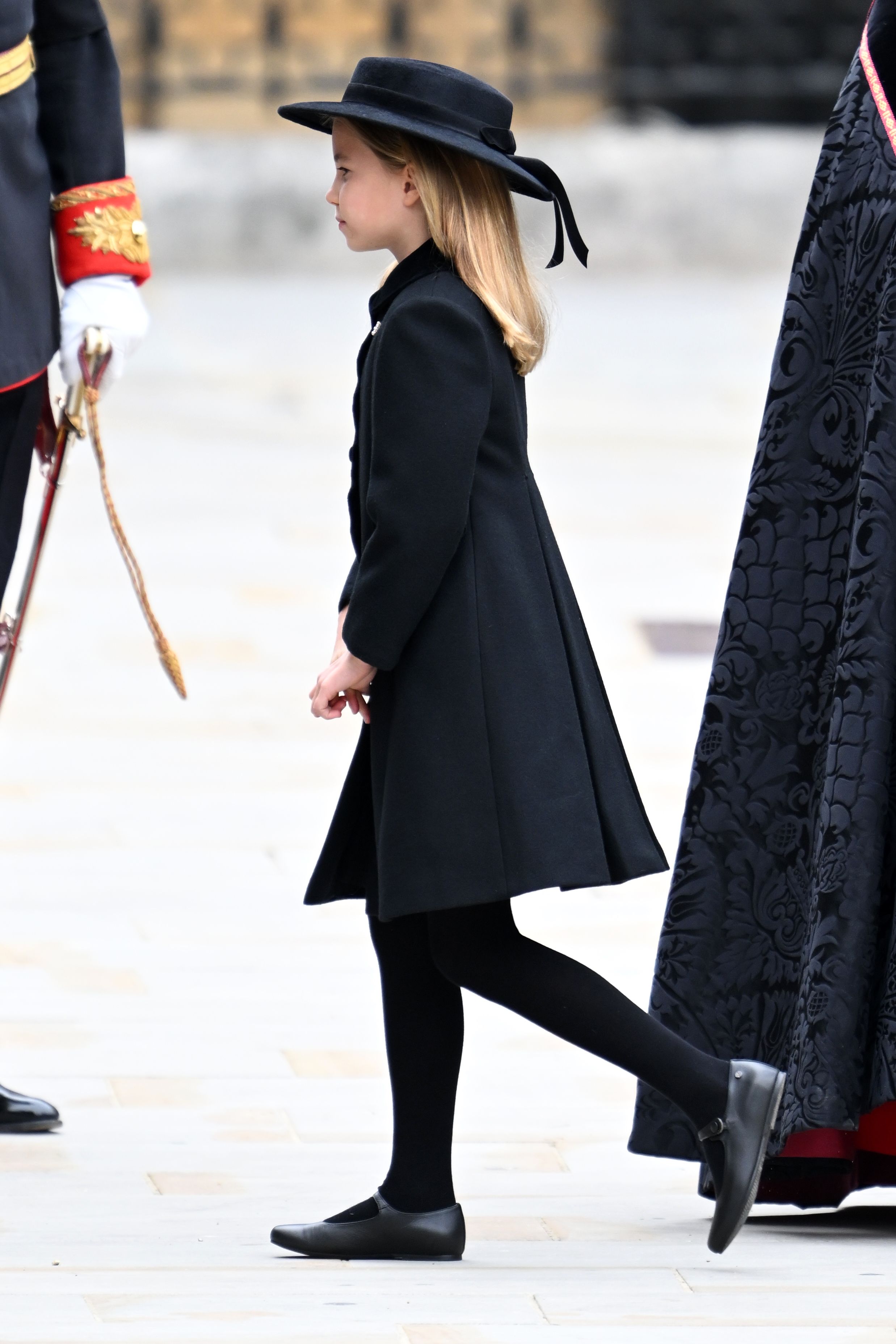 <p>Princess Charlotte was a mini-me version of mom Princess Kate as she arrived at London's Westminster Abbey for <a href="https://www.wonderwall.com/celebrity/royals/best-photos-from-queen-elizabeth-ii-funeral-king-charles-princes-william-prince-harry-george-charlotte-kate-meghan652347.gallery">the state funeral</a> of her great-grandmother Queen Elizabeth II on Sept. 19, 2022.</p>