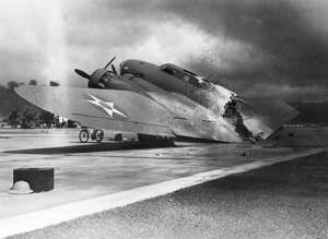 7th December 1941: A damaged B-17C Flying Fortress bomber sits on the tarmac near Hangar Number 5 at Hickam Field, after the Japanese attack on Pearl Harbor, Hawaii. (Photo by Hulton Archive/Getty Images)