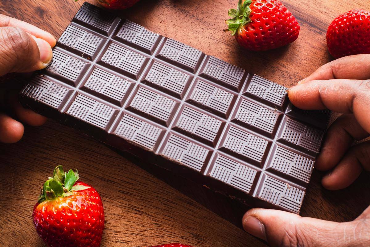 <p>While dietitian Bonnie Taub-Dix suggested that a little dark chocolate could help control cravings when mixed with nuts and dried fruit, there's a simpler combination that could be just as effective.</p> <p>Because when you pair that chocolate with strawberries instead, you unlock the powers of a fruit that <a href="https://drgalland.com/" rel="noopener noreferrer">Dr. Leo Galland</a> described as reducing the inflammation that keeps certain hormones from otherwise slimming us down. Strawberries also help produce a hormone called adiponectin, which enhances metabolism and suppresses appetites. </p>