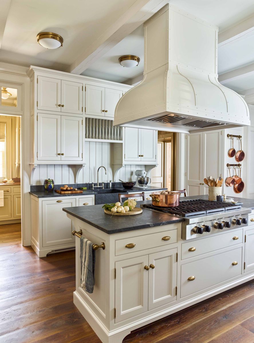 <p>In <a href="https://www.veranda.com/decorating-ideas/house-tours/a36704593/gil-schafer-waterfront-maine-house-tour/">this coastal Maine home designed by architect Gil Schafer</a>, the kitchen cabinetry and custom metal hood are painted Pale Oak by <a href="https://go.redirectingat.com?id=74968X1553576&url=https%3A%2F%2Fwww.benjaminmoore.com%2Fen-us&sref=https%3A%2F%2Fwww.veranda.com%2Fdecorating-ideas%2Fg35091957%2Fkitchen-cabinet-ideas%2F">Benjamin Moore</a> to make the <a href="https://www.veranda.com/decorating-ideas/g34899885/small-kitchens/">small kitchen</a> seem larger. </p>