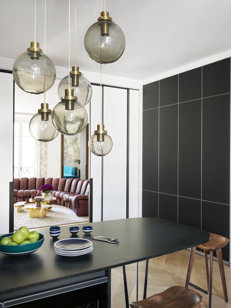<p>Floor-to-ceiling "locker" cabinets along one wall of this Paris kitchen designed by Raphaël Le Berre and Thomas Vevaud maximize storage space.</p>