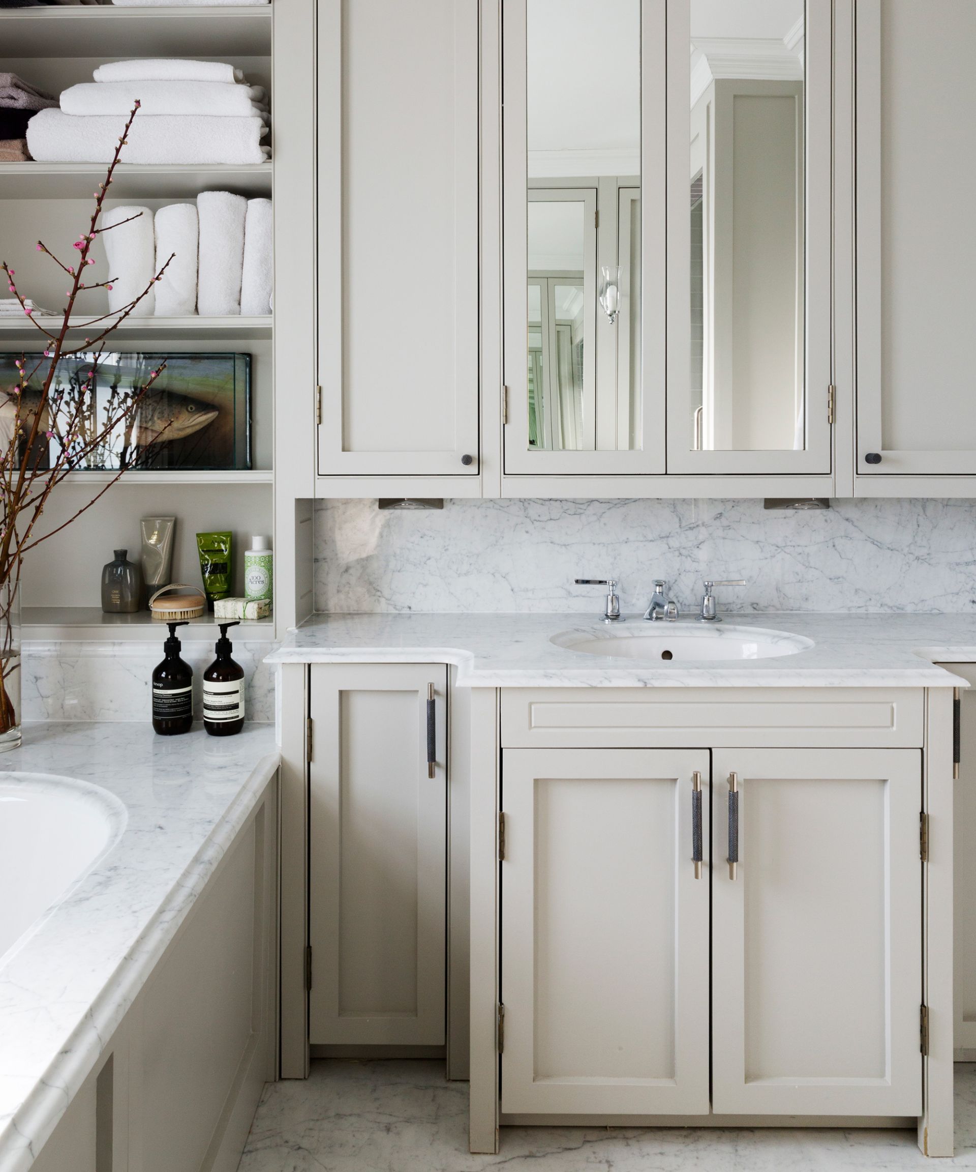 <p>                     ‘I would recommend a third of the budget goes towards storage,’ advises interior designer, Monita Cheung.                    </p>                                      <p>                     ‘If you invest well, furniture can easily become the main focal point. A key piece in every bathroom is a basin, therefore incorporating under-counter furniture is essential.’                   </p>                                      <p>                     ‘Large bathroom vanity units fitted underneath the basin with an additional internal drawer always helps to hide the daily clutter.                    </p>                                      <p>                     'There are many different bathroom vanities that will create ample storage. For example, a jumbo drawer base unit provides storage for large towels and tall bottles, while a sleek mirror cabinet can be used to hide the electric toothbrush/shaver, keeping surfaces clear.                    </p>                                      <p>                     'If there’s money left, a tall storage unit is always handy, especially if it can be semi-recessed into a stud wall to provide really deep storage but with a sleek exterior.’                   </p>