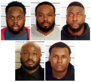 This combo of booking images provided by the Shelby County Sheriff's Office shows, from top row from left, Tadarrius Bean, Demetrius Haley, Emmitt Martin III, bottom row from left, Desmond Mills, Jr. and Justin Smith.