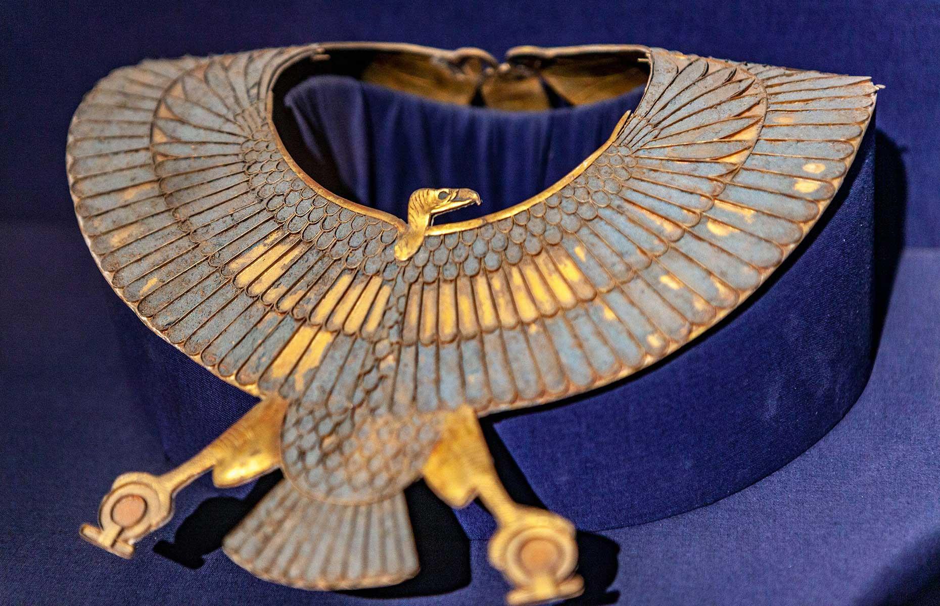 <p>Also found inside Shoshenq II's tomb was this breastplate-like collar. While the colours have faded slightly, you can still get a sense of just how opulent it must have been. The jewellery piece is shaped like a falcon and depicts the goddess Nekhbet, who <a href="https://ancientegyptonline.co.uk/nekhbet/">often appeared in vulture form</a> and hovered above kings holding the shen (circle, or sun disc) to represent eternity.</p>