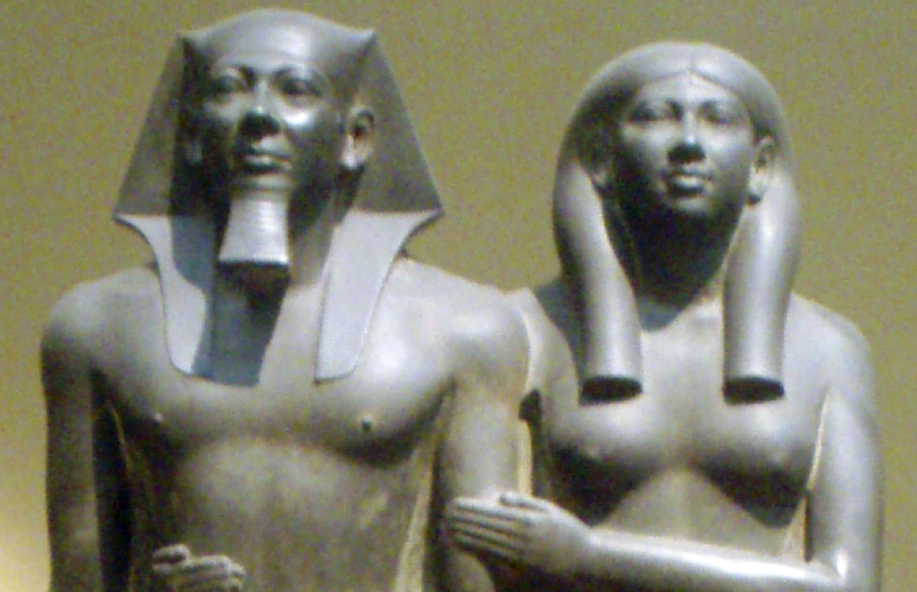 <p>Many statues from inside the tomb depict Menkaure accompanied by gods and other figures. One greywacke stone statue recovered from the pyramid depicts Menkaure and his wife standing side by side. It's a classic example of Old Kingdom royal tomb sculpture, with both the king's arms down by his sides and with one leg stepped forward.</p>