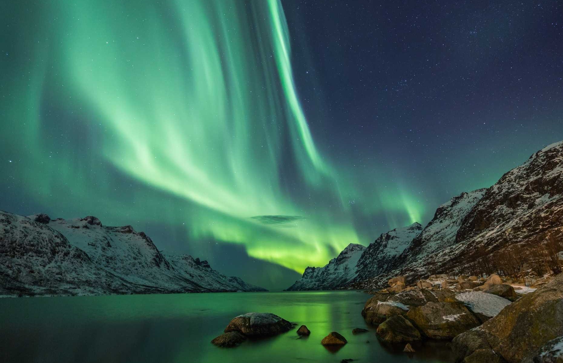 <p>There are only a select handful of places in the world where the aurora borealis is visible, and <a href="https://www.travelandleisure.com/trip-ideas/nature-travel/iceland-when-to-see-northern-lights">Iceland</a> is a place you can experience it in <a href="https://www.earthtrekkers.com/iceland-bucket-list-best-things-to-do-in-iceland/">between</a> day trips to stunning waterfalls, lagoons and volcanoes. If the northern lights are top of your priority list, <a href="https://www.visiticeland.com/article/northern-lights-in-iceland">booking between</a> September and April is your best bet, though budget accordingly: the average cost of an Iceland trip is between $90 and $290 per day, making it one of the pricier options for travel in 2023.</p>