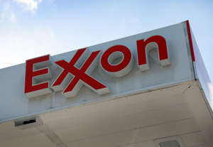 An Exxon sign hangs at a gas station on January 31, 2023 in Miami, Florida. Exxon Mobil Corp. reported its highest-ever annual profit last year of $55.7 billion.