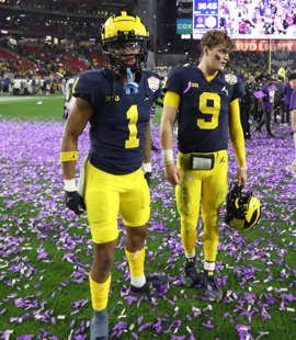 Michigan defensive back Ja'Den McBurrows, left, and quarterback J.J. McCarthy watch after the 51-45 loss to TCU in the Fiesta Bowl on Saturday, Dec. 31, 2022, in Glendale, Arizona.