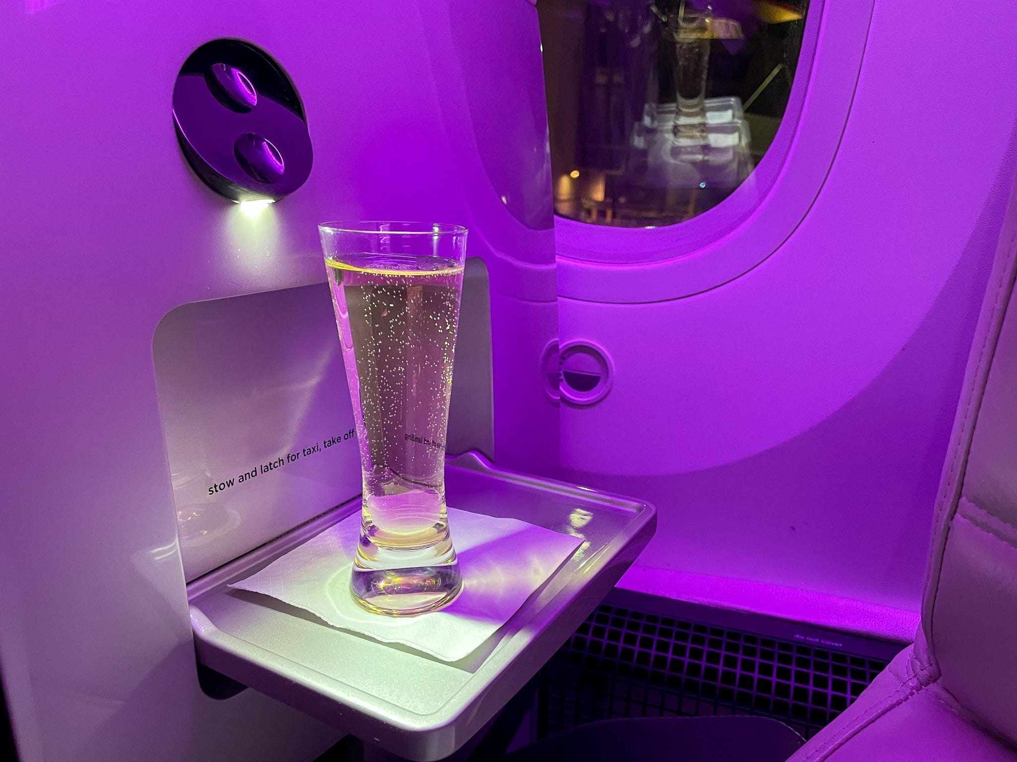 <p>As I boarded the Boeing aircraft, a flight attendant asked if I would like a glass of Champagne or something to drink before takeoff.</p><p>I'm used to a smiling flight attendant handing me a sanitizing wipe when I've boarded — not a glass of bubbly. </p><p>I happily accepted a flute. Shortly after, another flight attendant came by with a tray of roasted nuts. I quickly learned that I would never be hungry or thirsty on this flight.</p><p>I also realized that the snacks I packed in my backpack wouldn't be needed. Instead, I was part of the group I'm typically envious of: the first-class travelers who have space, snacks, and endless alcohol to enjoy on their plane ride. It was a thrilling experience, and I planned to take advantage of every perk. </p>