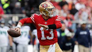 San Francisco 49ers quarterback Brock Purdy passes against the Seattle Seahawks during the first half of a wild-card playoff game in Santa Clara, Calif., Jan. 14, 2023. AP Photo/Josie Lepe