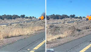 Random vehicle completely on fire drives down highway