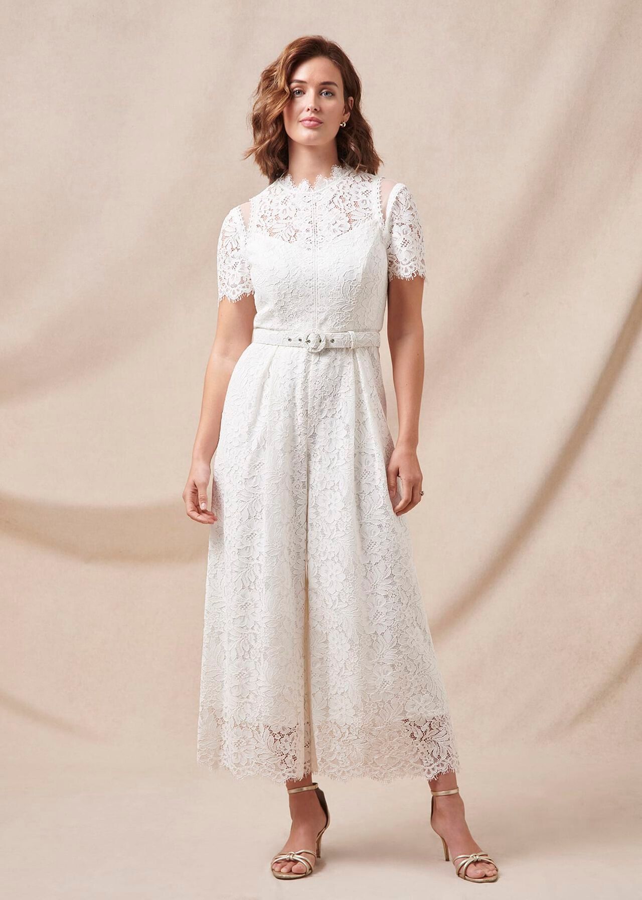 <p><strong>£259.00</strong></p><p>Phase Eight's new bridal range is TDF – and really affordable, tbh. This jumpsuit is cut from scalloped Leavers lace that's left partially unlined to showcase the intricate floral design. We love the cropped wide legs and buckled waist belt, too.</p>