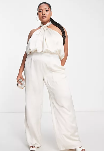 <p><strong>$78.00</strong></p><p>Striking the perfect balance between elegant and sexy, Pretty Lavish's bridal jumpsuit has a wide-leg silhouette, a halter neckline and a gorge open back. Channel Hollywood glamour looks and wear yours with a bold red lip this wedding szn. </p>