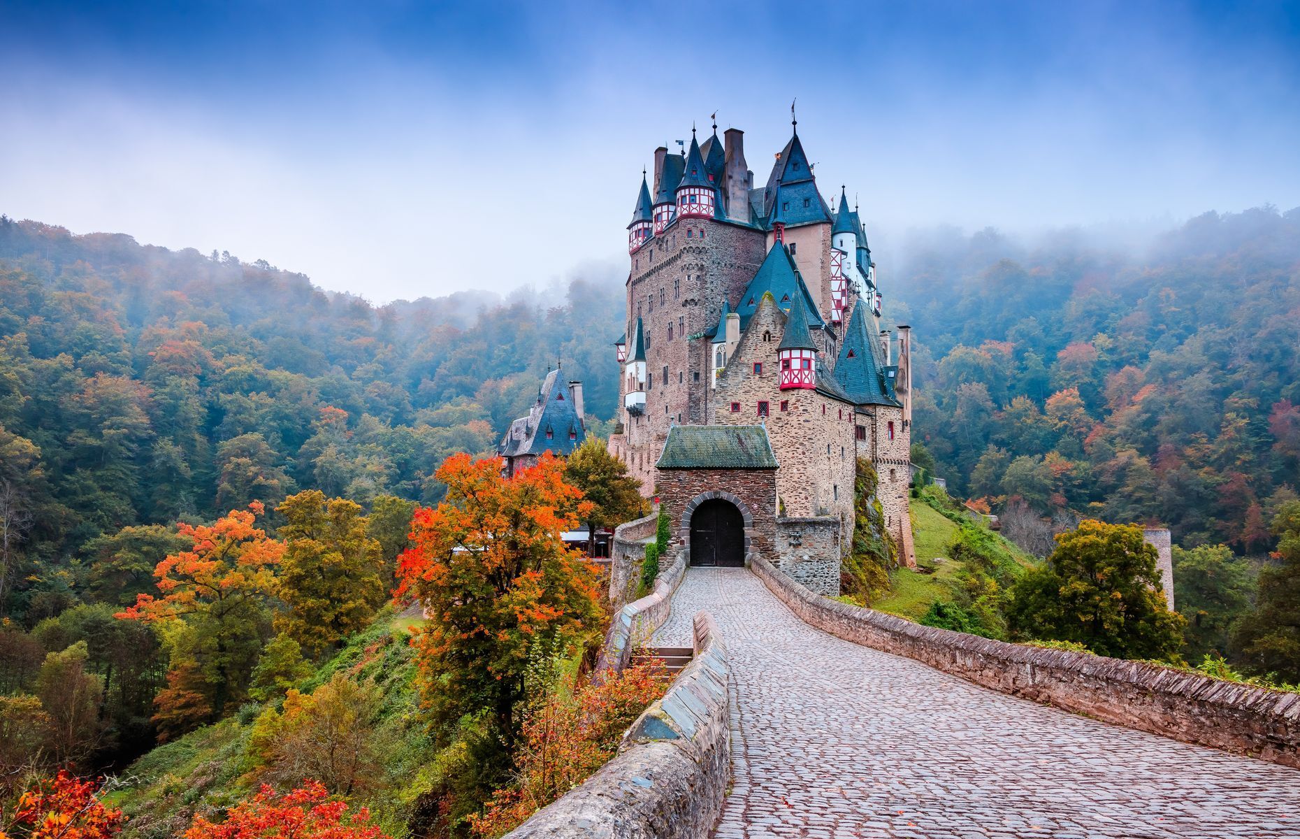 <a href="https://burg-eltz.de/en/homepage" rel="noreferrer noopener">Eltz</a> is one of the few castles in Germany that still belongs to the original family. In fact, 34 generations have lived there over the past 850 years. Open to the public from April to November, the castle that inspired Walt Disney’s setting for <em>Cinderella</em> (and its theme parks) is located in the heart of the Eltz Forest at the foot of the Elzbach River.