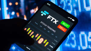 In this photo illustration, the stock trading graph of FTX Token (FTT) seen on a smartphone screen. Rafael Henrique/SOPA Images/LightRocket via Getty Images