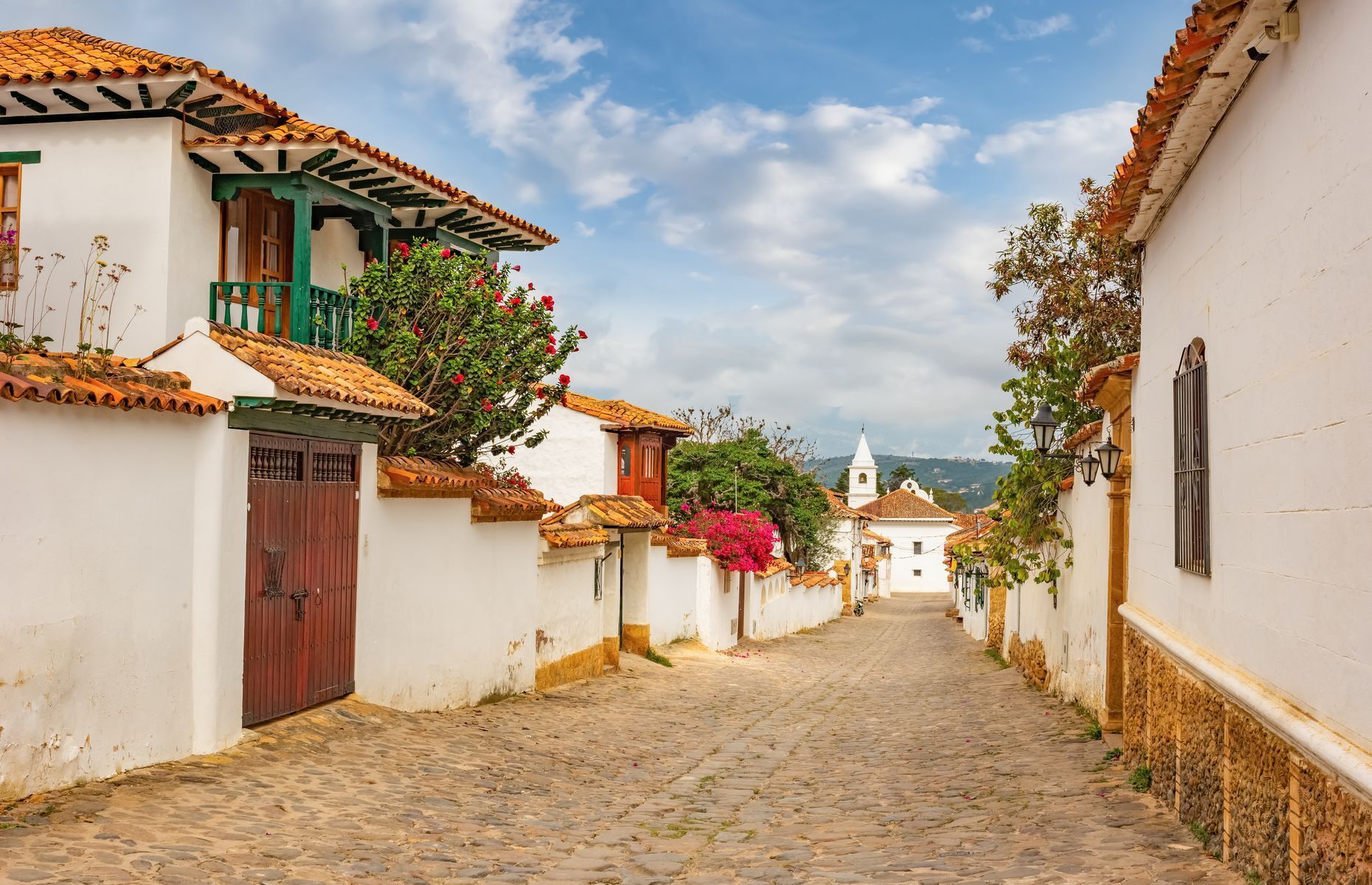 <a href="https://colombia.travel/en/villa-de-leyva" rel="noreferrer noopener">Villa de Leyva</a>, one of the most beautiful cities in Colombia. Located a mere three-hour drive from Bogotá, a stroll through its charming streets will allow you to admire its colonial architecture and make you feel like you’ve travelled back in time. Make sure to check out Plaza Mayor, the largest Spanish square in the country. If you’re interested in paleontology, you’ll be delighted to learn that the area harbours many fossils from the Cretaceous era.