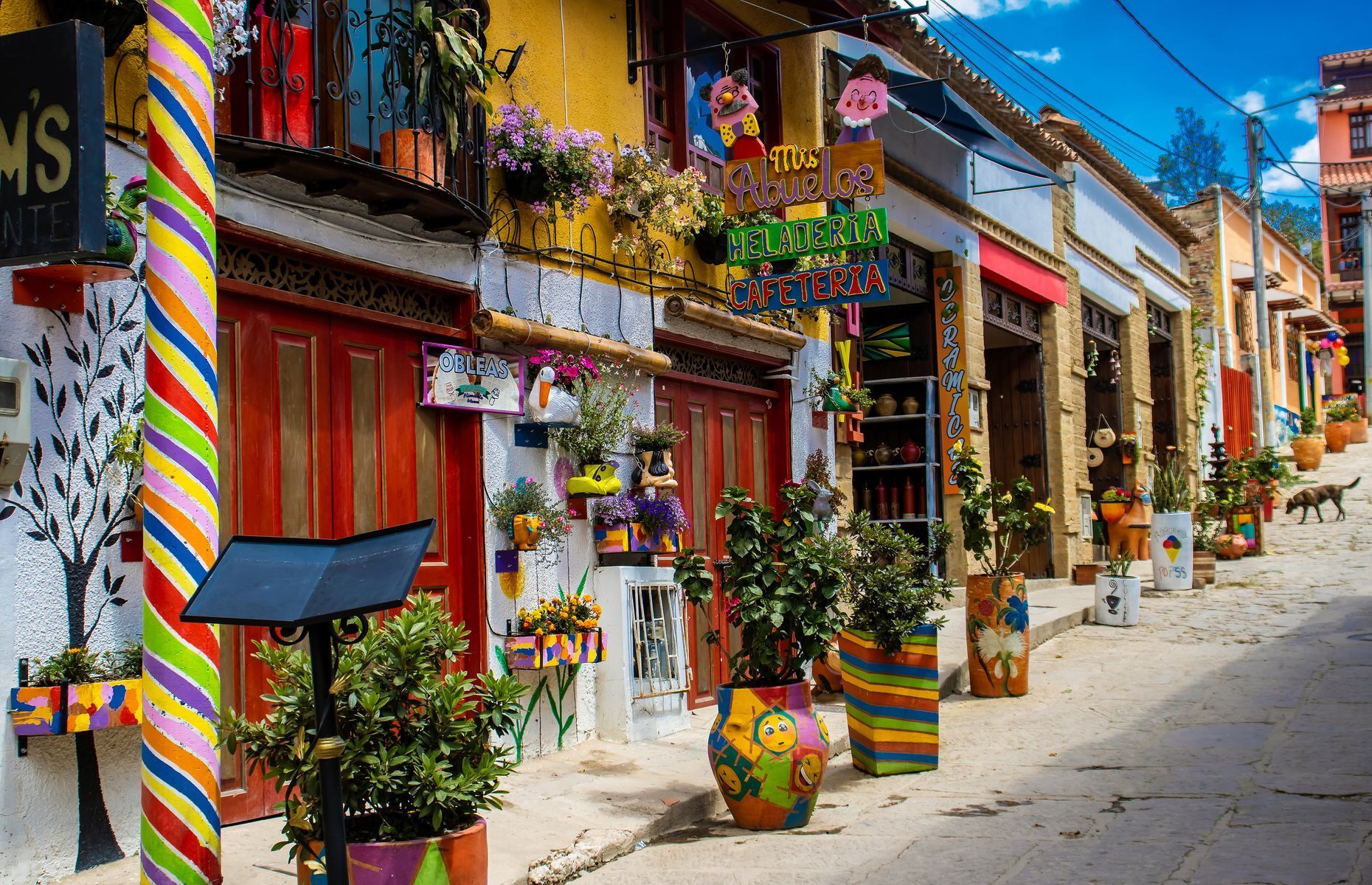 Not far from Villa de Leyva sits <a href="https://colombiatravelreporter.com/raquira-the-pottery-capital-of-colombia/" rel="noreferrer noopener">Raquira</a>, a colourful and vibrant town known for its thriving art scene—so much so that it’s also known as the pottery capital of Colombia. Here, you can buy unique handicrafts and explore the local market to get a better feel for the Colombian culture.