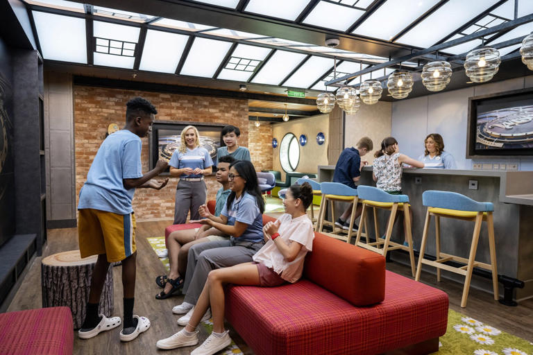 At Edge aboard the Disney Wish, tweens ages 11 to 14 years old play games and make new friends in a bright, colorful hangout inspired by a chic New York City loft.
