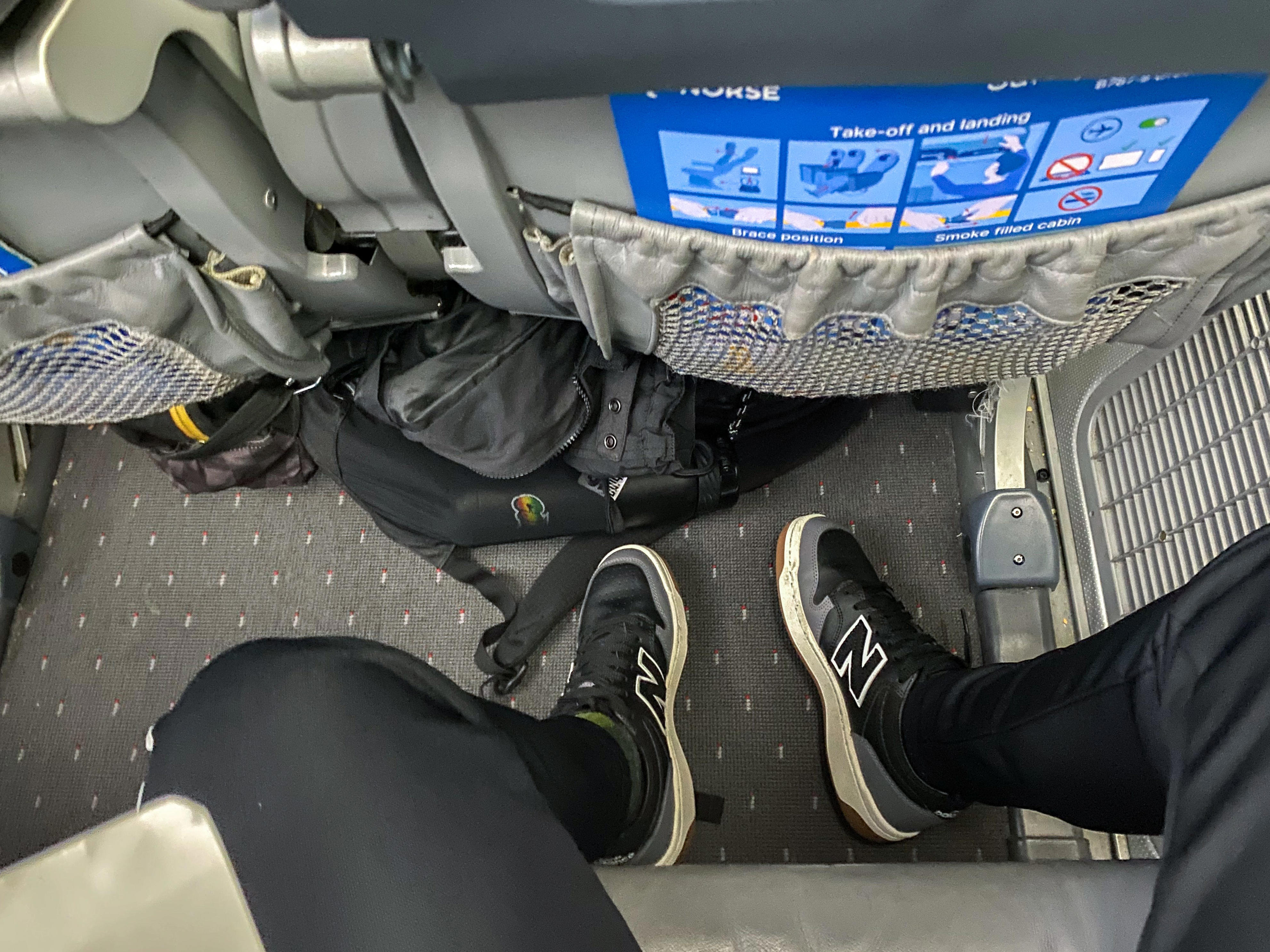 The seat pitch was between 27 and 32 inches, according to the representative. I thought I had enough legroom even with my backpack shoved underneath the seat.