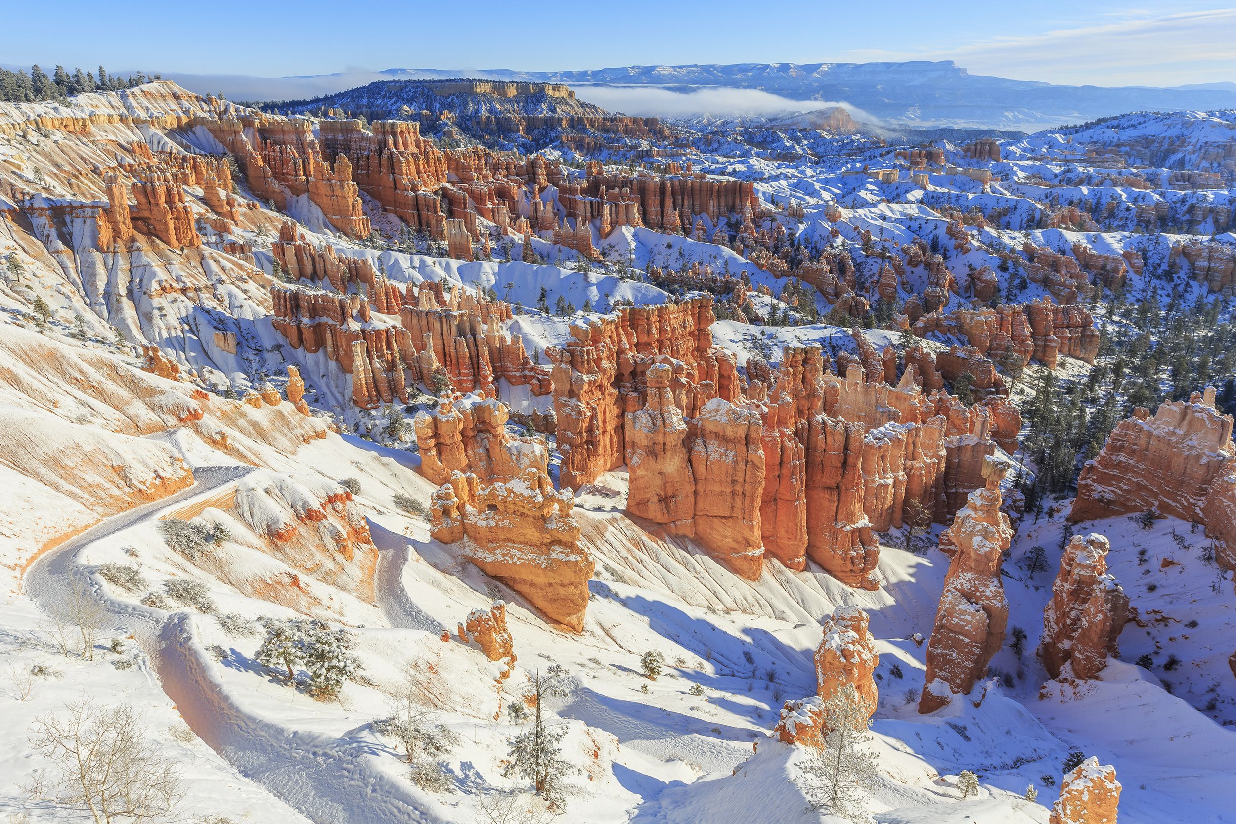 <p><a href="https://www.nps.gov/brca/index.htm">Bryce Canyon National Park</a> is unique for its geological structures, including gigantic natural amphitheatres and orangish rock spires called hoodoos. In winter, temperatures in the park average around freezing, but there are also fewer crowds there then. Visitors can enjoy skiing, snowshoeing, hiking, sightseeing and stargazing. Note: The canyon sits 9,000 feet above sea level, so altitude sickness is a potential problem.</p><p><b>Related:</b> <a href="https://blog.cheapism.com/vintage-national-park-photos/">33 Historic National Park Photos for Vintage Views</a></p>