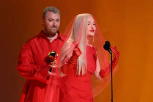 Kim Petras accepts the award for best pop duo/group performance with Sam Smith for “Unholy,” becoming the first transgender woman to win the category.