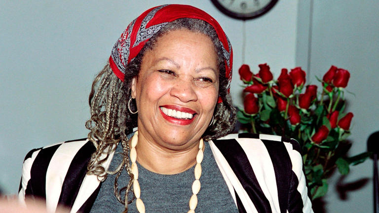 U.S. author Toni Morrison smiles in her office at Princeton University in New Jersey, while being interviewed by reporters on Oct. 7, 1993. DON EMMERT/AFP via Getty Images