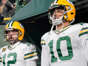 Aaron Rodgers, #12, and Jordan Love, #10 of the Green Bay Packers, look on prior to the game against the Tennessee Titans at Lambeau Field on Nov. 17, 2022 in Green Bay, Wisconsin. Patrick McDermott/Getty Images