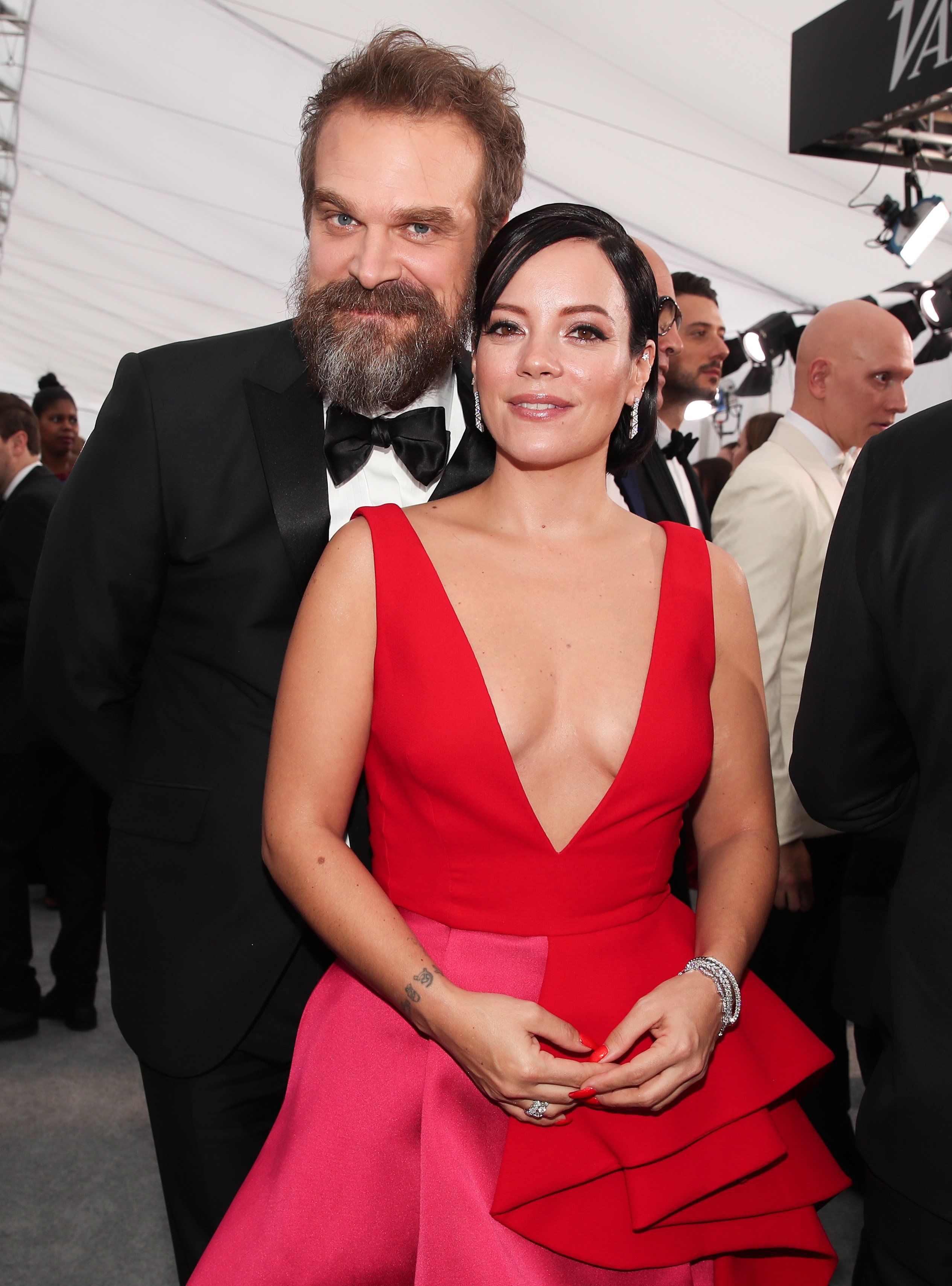 <p>"Stranger Things" star David Harbour and British pop singer Lily Allen struck many as an unexpected pairing when they took their romance public in 2019, a little more than a year before <a href="https://www.wonderwall.com/entertainment/stars-who-wed-in-vegas-21467.gallery?photoId=469489">they tied the knot in Las Vegas</a> in 2020. In July 2022, the world learned how their relationship started: They met on the ultra-exclusive dating app Raya. "I was in London alone, doing 'Black Widow,' on this app, going on dates and stuff. And yeah, I started texting with her, she was in Italy at the time — we got together, went on a date at the Wolseley [restaurant in London], and it was, you know, she's f****** unbelievable," David told <a href="https://www.gq-magazine.co.uk/culture/article/david-harbour-stranger-things-finale-interview">GQ Hype</a> in July 2002. </p><p>They fell for each other hard and fast. "She claims to have fallen in love at first sight with me — I mean, who wouldn't?" he quipped before sharing when he fell in love with her. "I remember the exact moment. It was our third date. I was just in this phase where I was like, I'm just going to be brutally honest about everything, because why lie? And I told her something about my life, about my beliefs..." he said, adding, "It would take a really extraordinary person to be accepting of the things that I said. And I remember thinking: Wow, that's somebody I want to be around."</p>