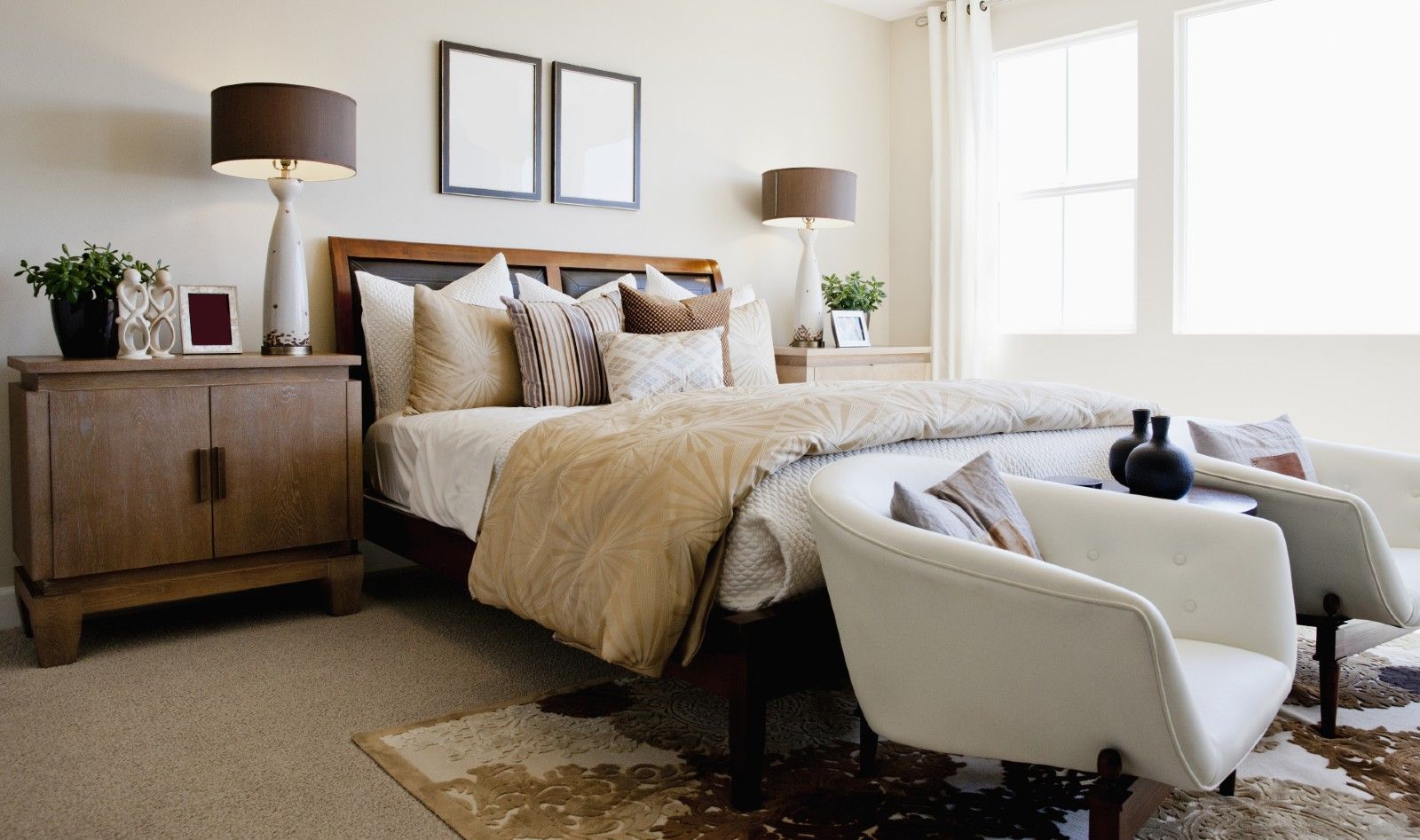 <p>                     To create a cohesive, inviting room, the experts say we should avoid picking ‘suite’ style bedroom sets.                    </p>                                      <p>                     Georgia explained, “Start with the bed first, something that draws the eye like a modern four-poster, a statement emperor bed, or silk upholstered bed head. Then choose minimal, practical furniture that works in harmony and doesn’t clutter the room.”                    </p>                                      <p>                     To help a bedroom feel like a boutique hotel she suggests choosing a velvet bed head in gray, or for something more opulent look for French-style upholstered beds with ornate detailing. Try painting or reupholstering items you already own to save on buying lots of new pieces.                   </p>                                      <p>                     "Classic hardware including chairs, vanity sets, and wardrobes can set the tone for your bedroom," says Laura, "Wooden furniture pieces can significantly increase a room’s luxurious feel."                   </p>