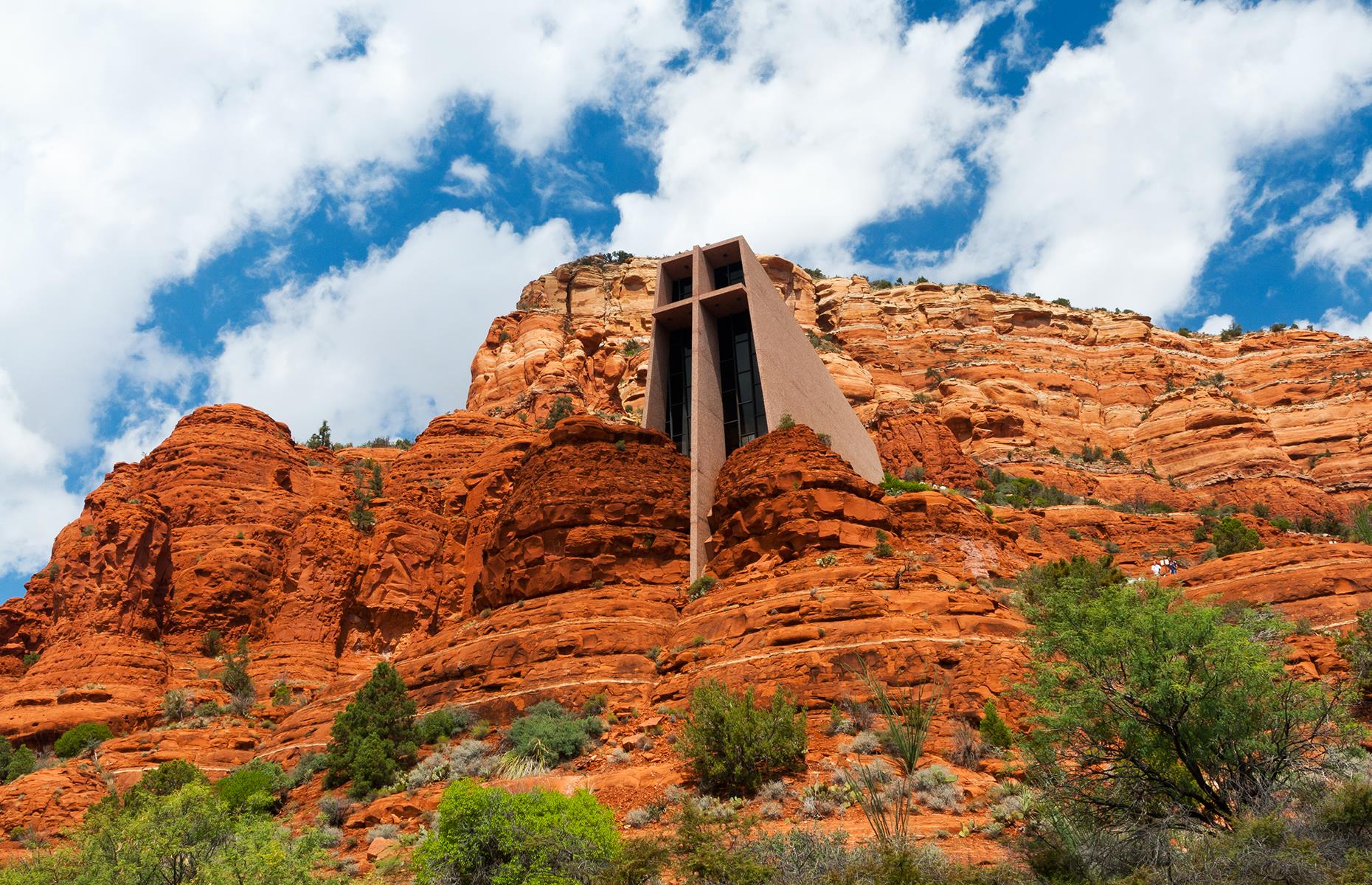 <p>Blending into the surrounding red rocks, this chapel was built in 1956 by visionary architect and sculptor Marguerite Brunswig Staude. It was designed to reflect the spiritual essence of the Sedona landscape. Staude was inspired by the powerful steel frameworks of skyscrapers – a theme that's explored with its central iron cross, which serves both a structural support and aesthetic purpose. The striking design is rounded off with a 210-foot-tall (64m) central nave and windowed altar.</p>  <p><strong><a href="https://www.facebook.com/loveexploringUK?utm_source=msn&utm_medium=social&utm_campaign=front">Love this? Follow us on Facebook for more travel inspiration</a></strong></p>