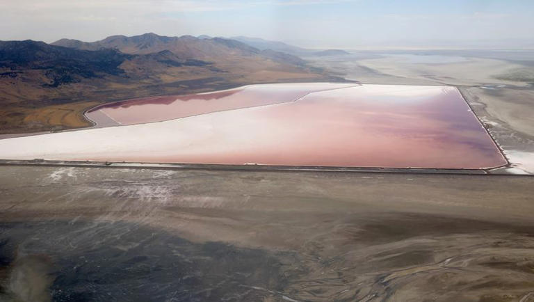 A salt evaporation pond and exposed lakebed are pictured on the east side of Promontory Point in the Great Salt Lake on Thursday, Aug. 4, 2022. The Great Salt Lake is experiencing record low water levels.