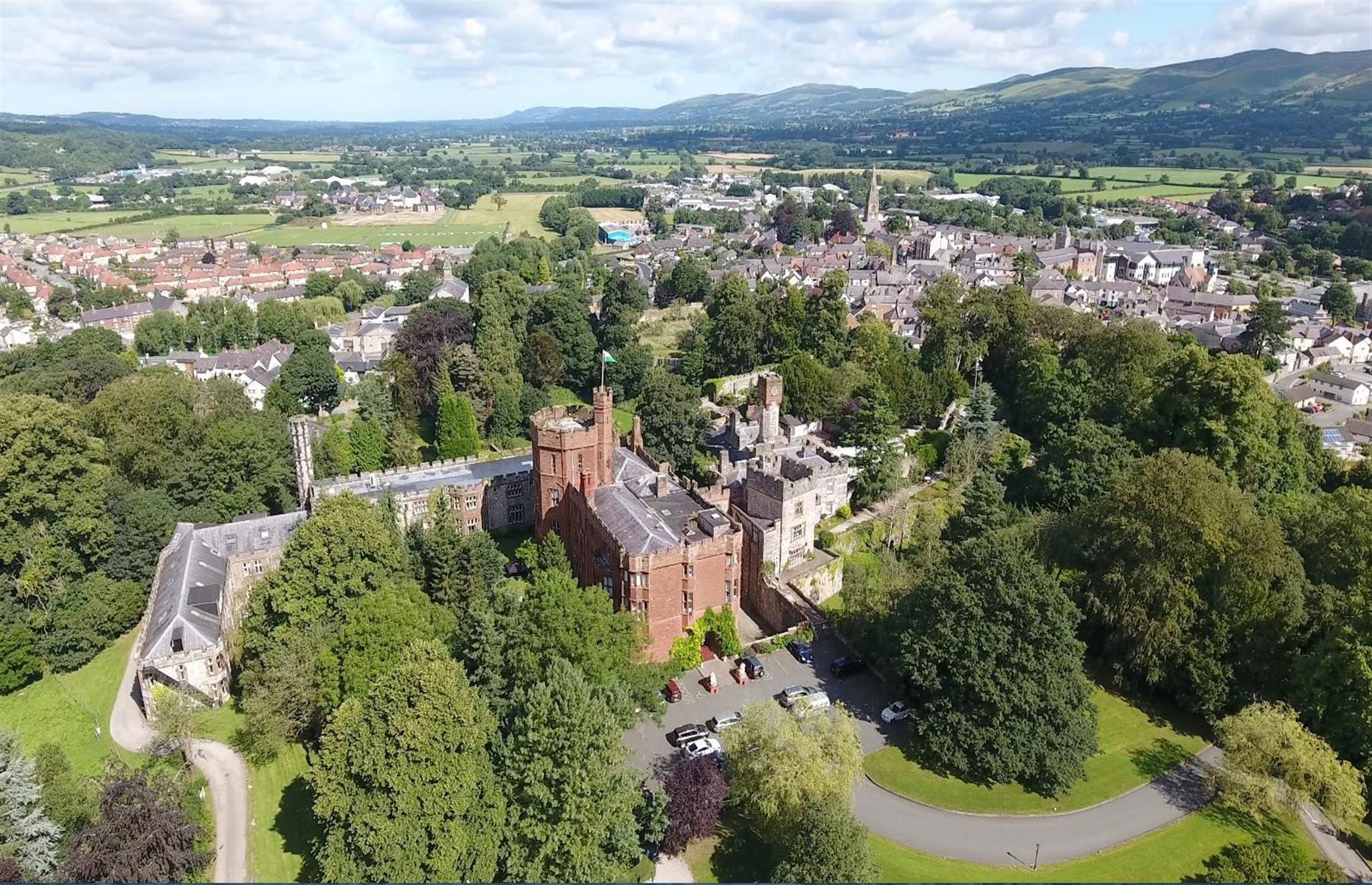 <p>Wales' <a href="https://www.ruthincastle.co.uk/">Ruthin Castle</a> – which has its roots right back in the 1200s – has passed through the hands of many kings over the centuries (including King Henry VIII). Today the plush hotel is still fit for royalty, with upscale restaurants and a spa that apparently welcomes guests both living and dead. They include Lady Grey, a phantom who purportedly wanders the castle halls and battlements, having been executed for murdering her husband's mistress.</p>