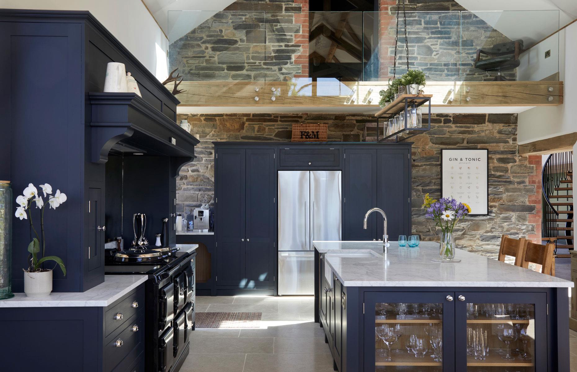<p>If you have particularly high ceilings or are converting an airy barn-style space, think about incorporating a <a href="http://www.loveproperty.com/news/79911/from-atriums-to-mezzanines-7-ways-to-design-your-interior-floor-plan">mezzanine floor</a> into your design. Whether used as a seating nook, library or study, it will allow you to create a more intimate room within your airy open-plan living area. In this scheme, translucent barriers add a contemporary feel while still allowing a seamless flow between the two levels.</p>