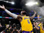 Los Angeles Lakers forward LeBron James tosses powder in the air prior to the team's NBA basketball game against the Oklahoma City Thunder on Tuesday, Feb. 7, 2023, in Los Angeles.